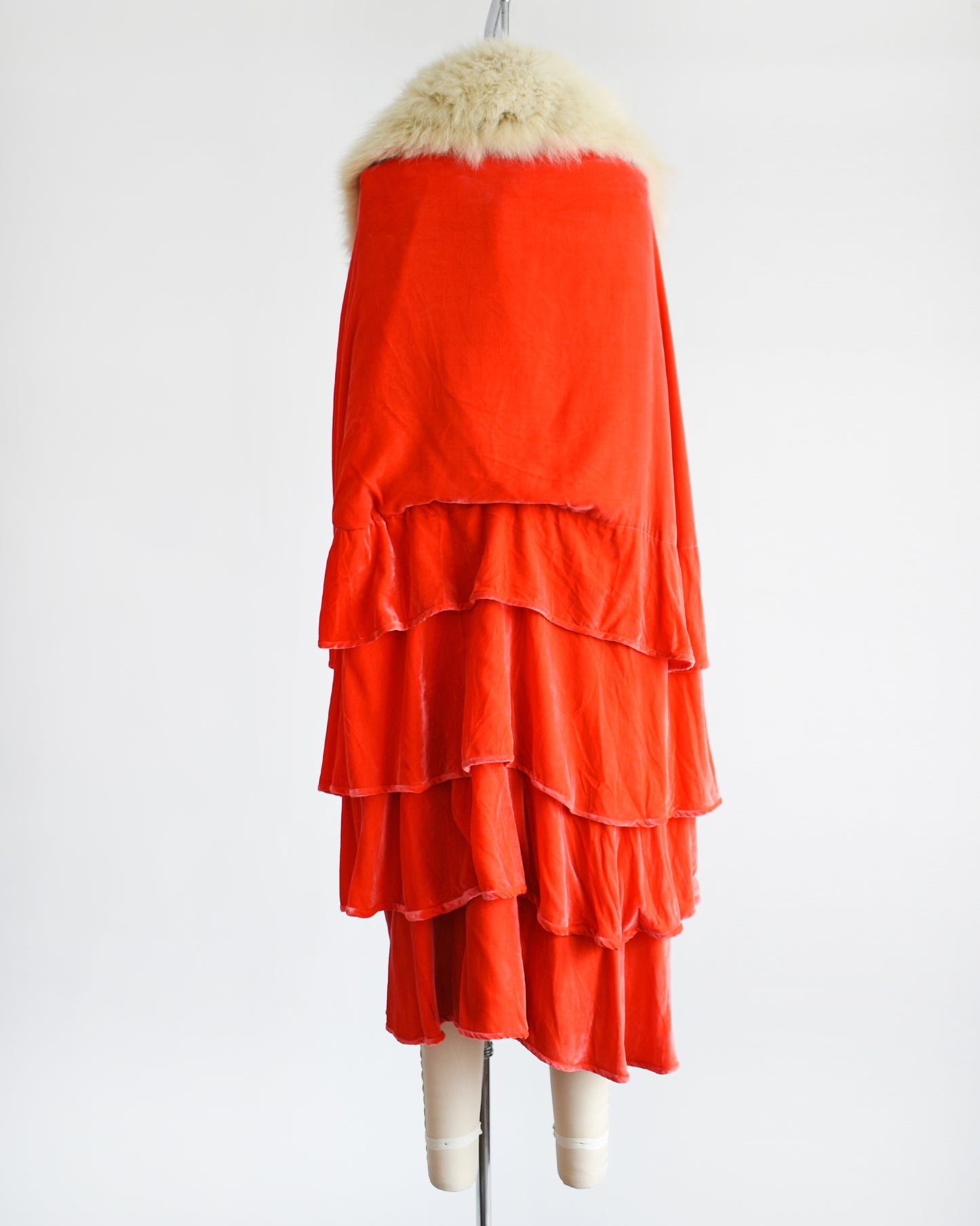 Back view of a vintage 1920s ruffled silk velvet opera coat with cream fox fur trim