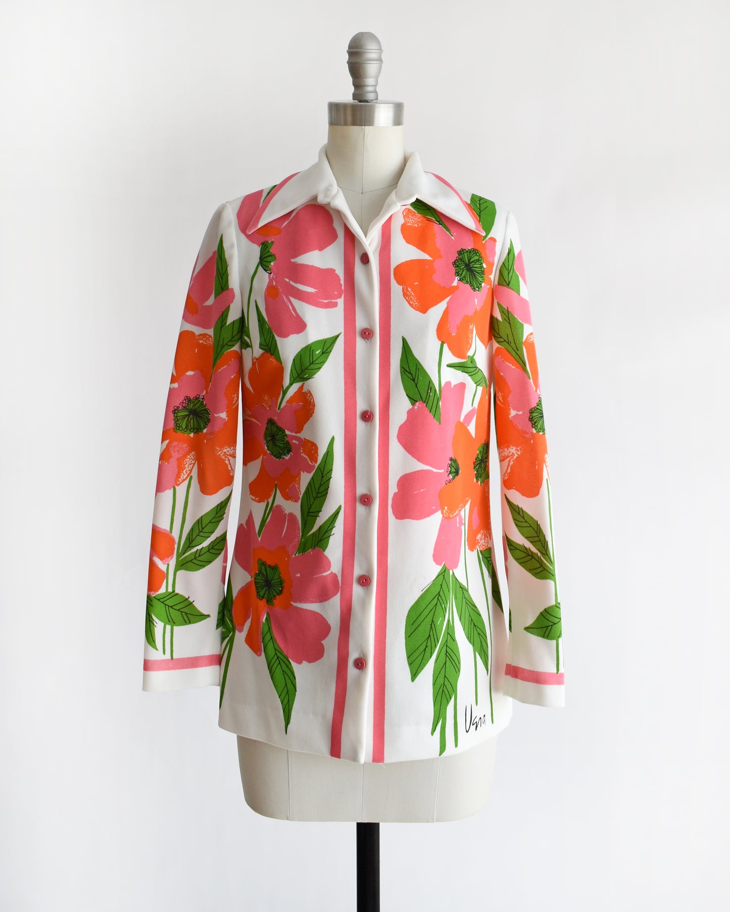 a vintage 1970s floral patterned Vera shirt on a mannequin against a white background