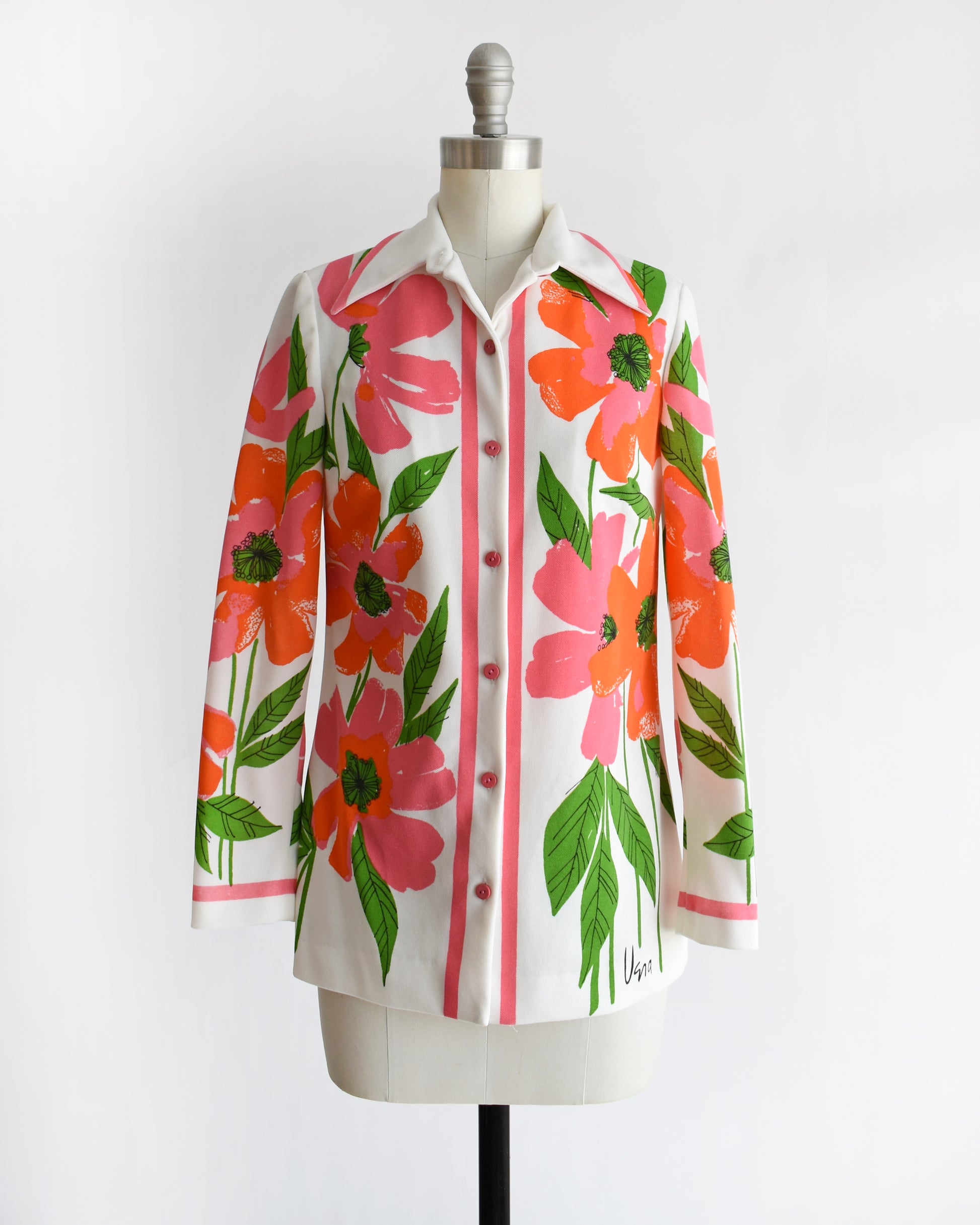 a vintage 1970s floral patterned Vera shirt on a mannequin against a white background