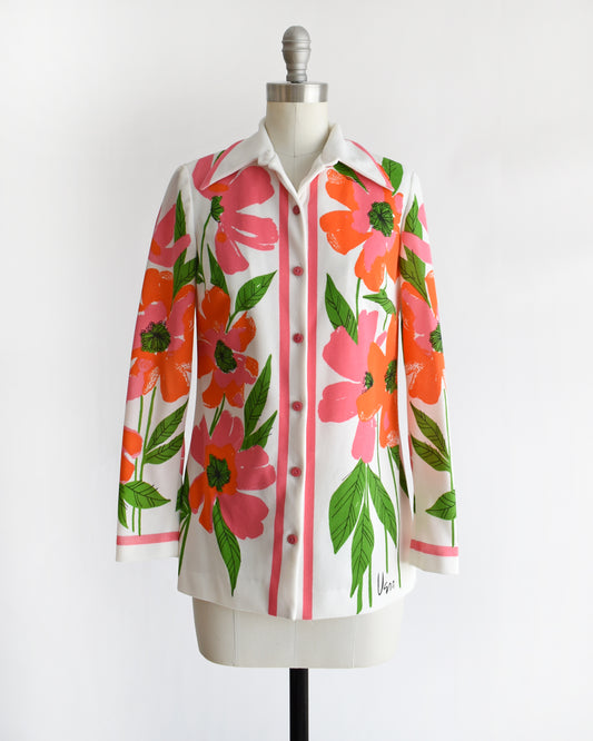 a vintage 1970s floral patterned Vera shirt on a mannequin against a white background
