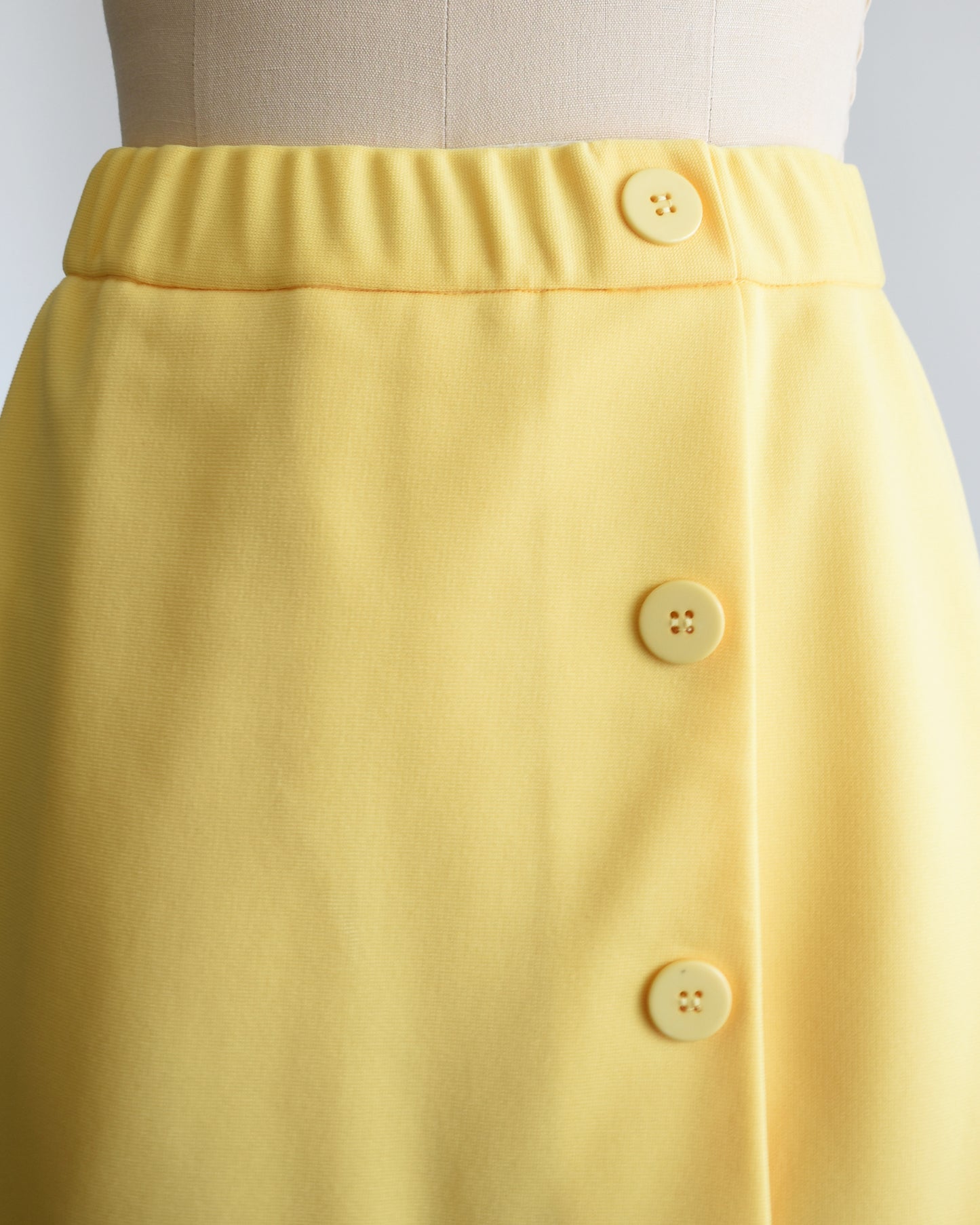 close up of the buttons on the left side of skirt