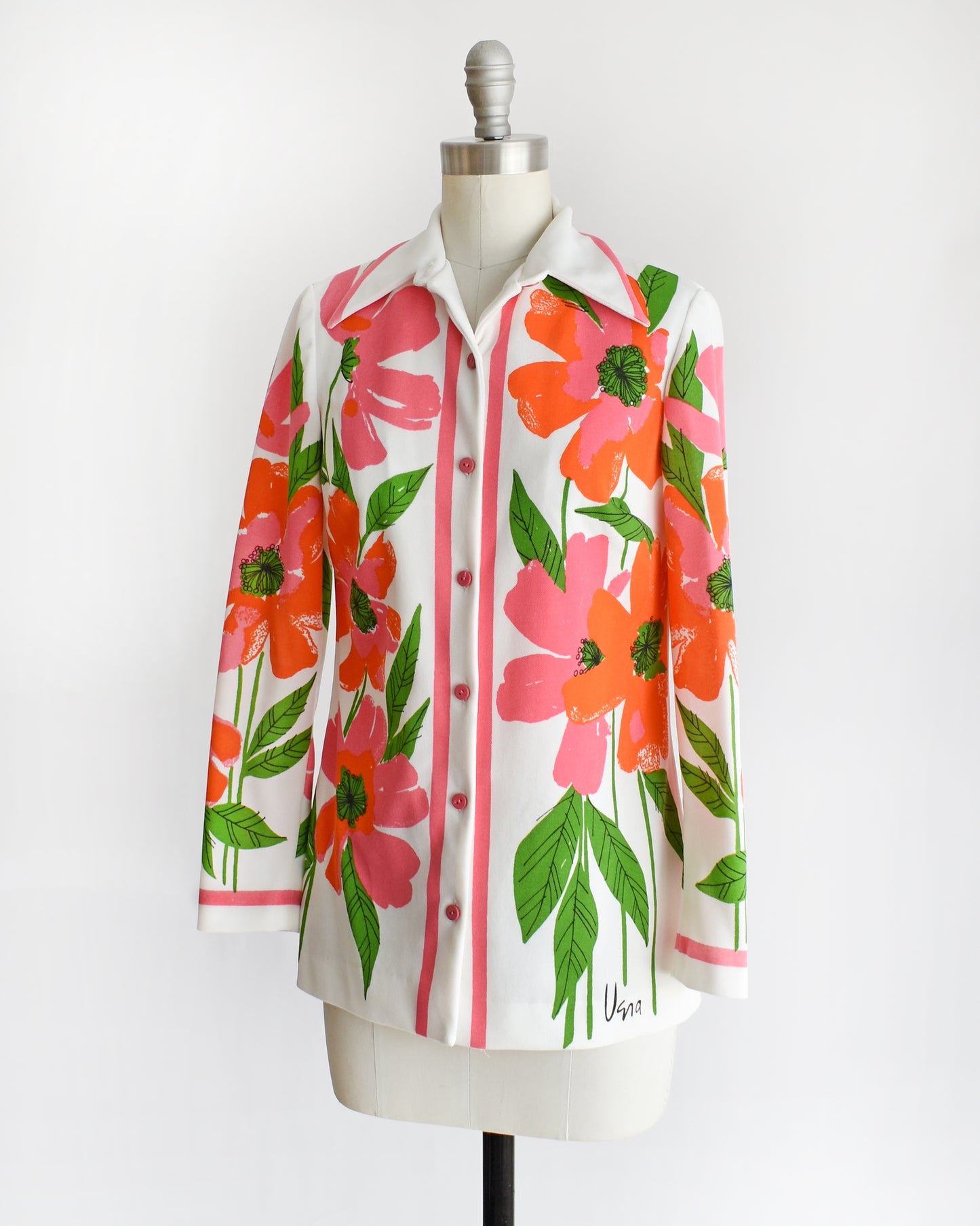 side front view of a vintage 1970s floral patterned Vera shirt on a mannequin against a white background