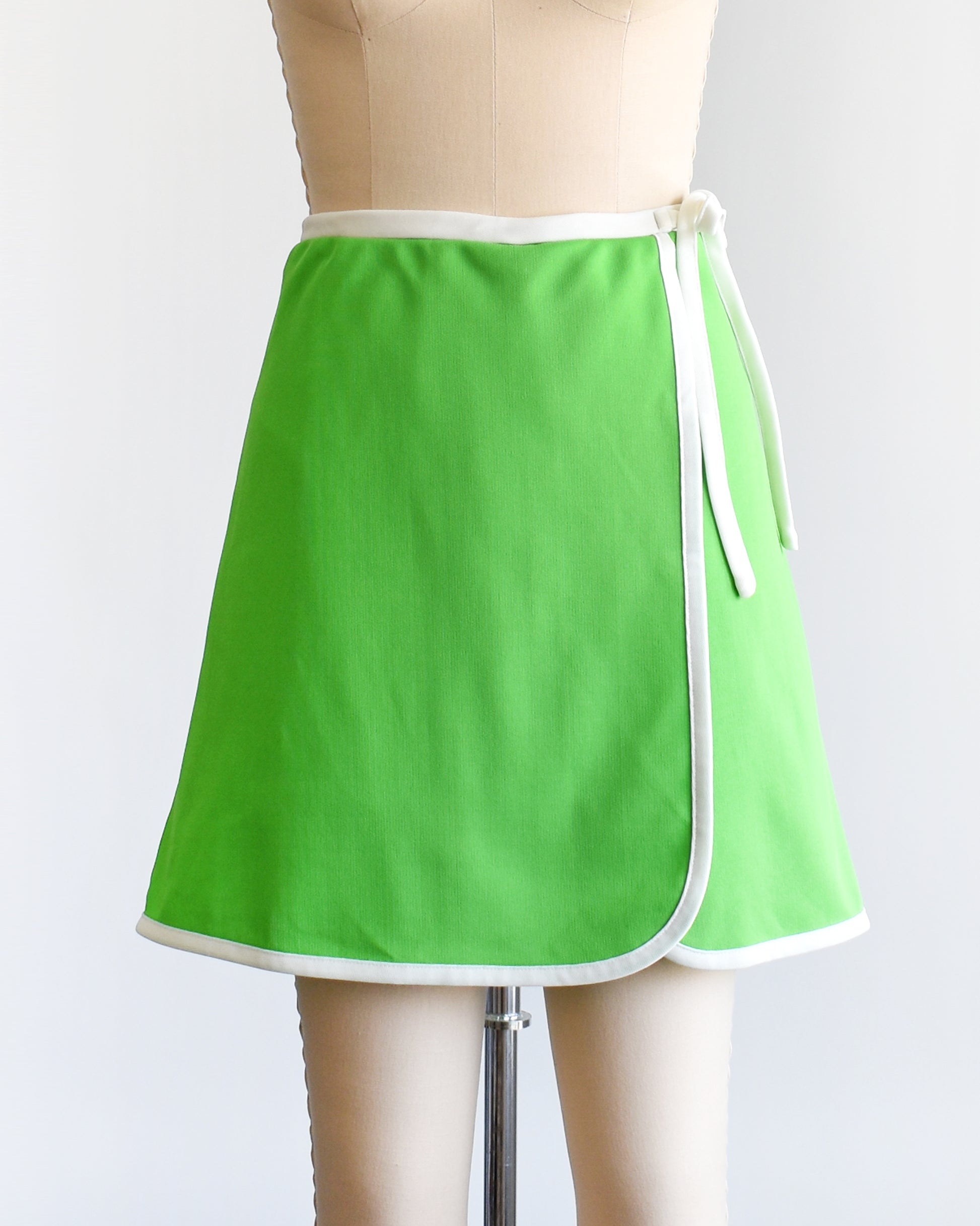 a vintage 1970s green and white skort with decorative tie