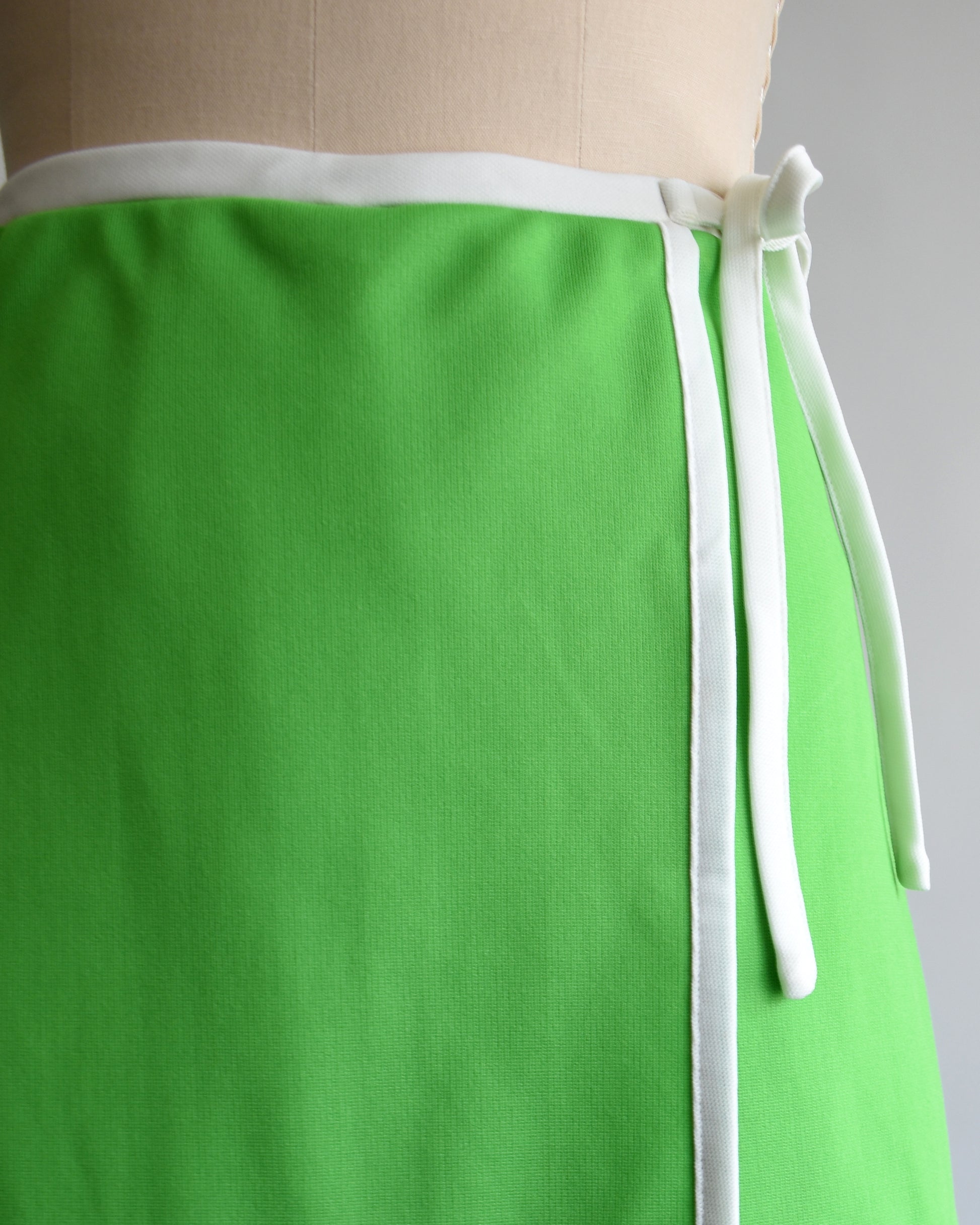 close up of the waist and decorative tie on the skort