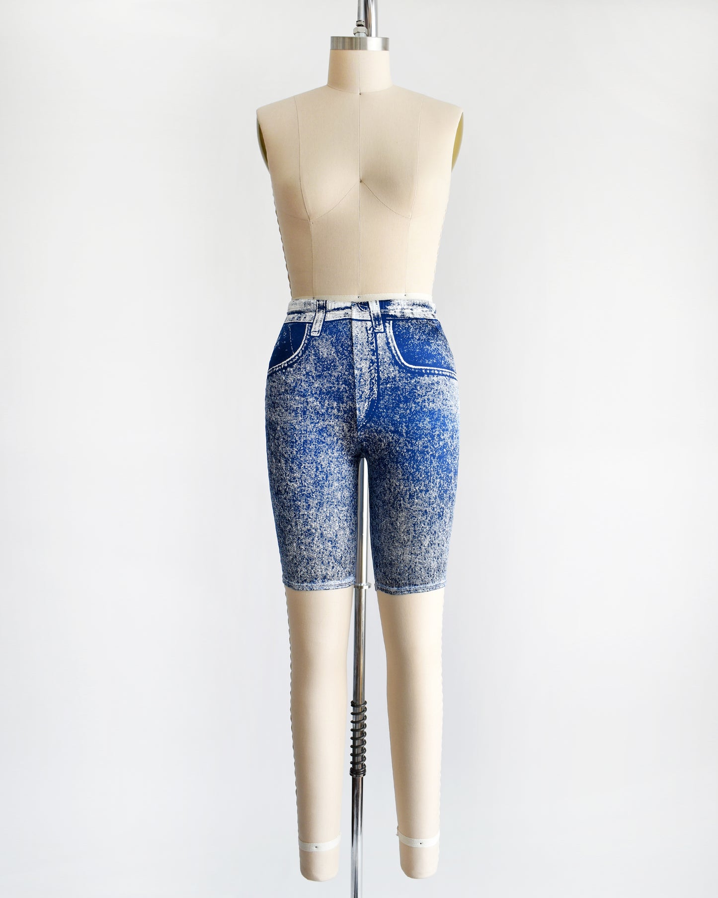 a pair of vintage 1980s/1990s faux denim spandex bike shorts on a dress form