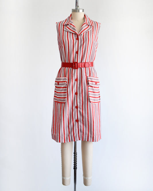 a vintage 1970s red and white striped dress on a mannequin against a white background