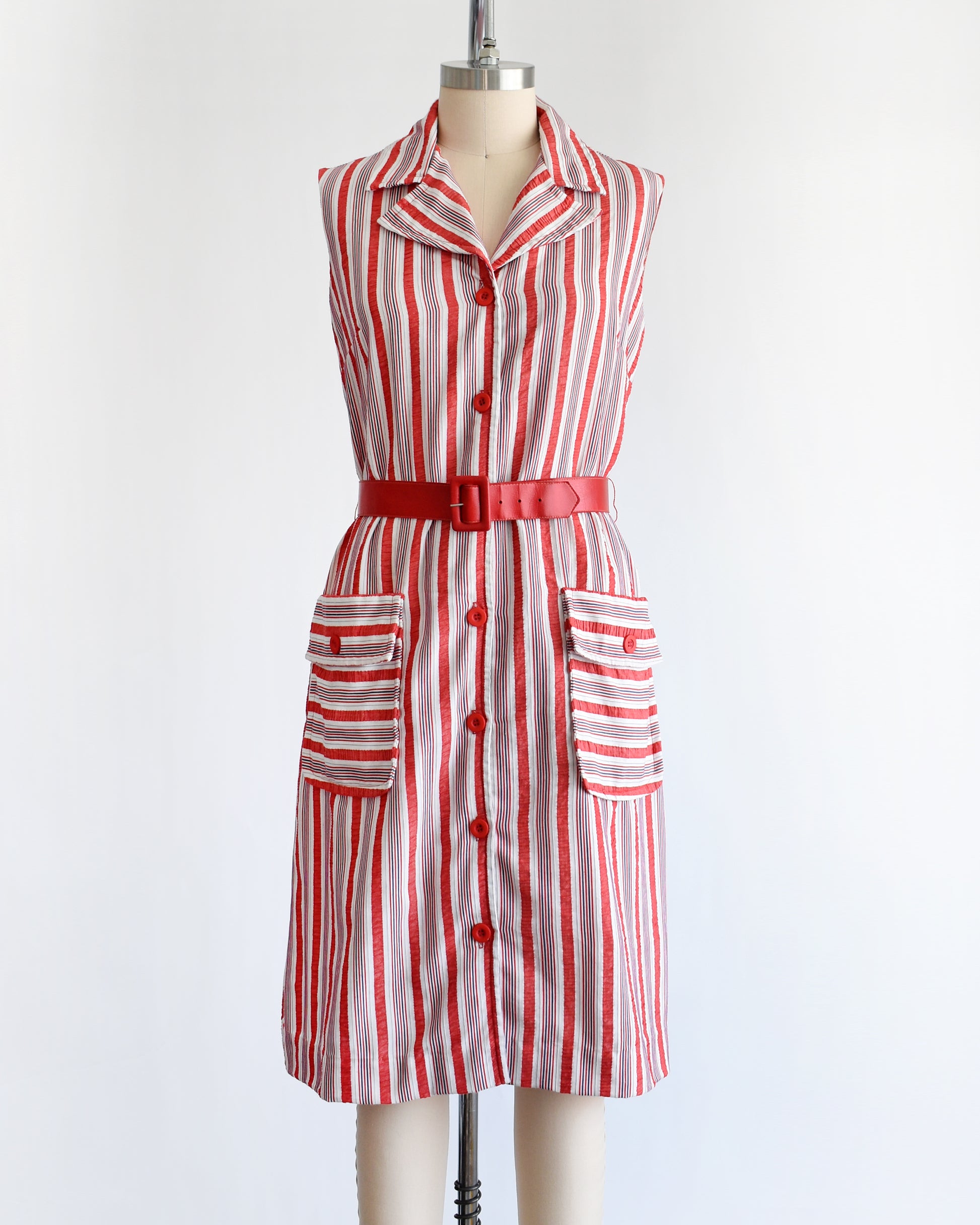 a vintage 1970s red and white striped dress on a mannequin against a white background