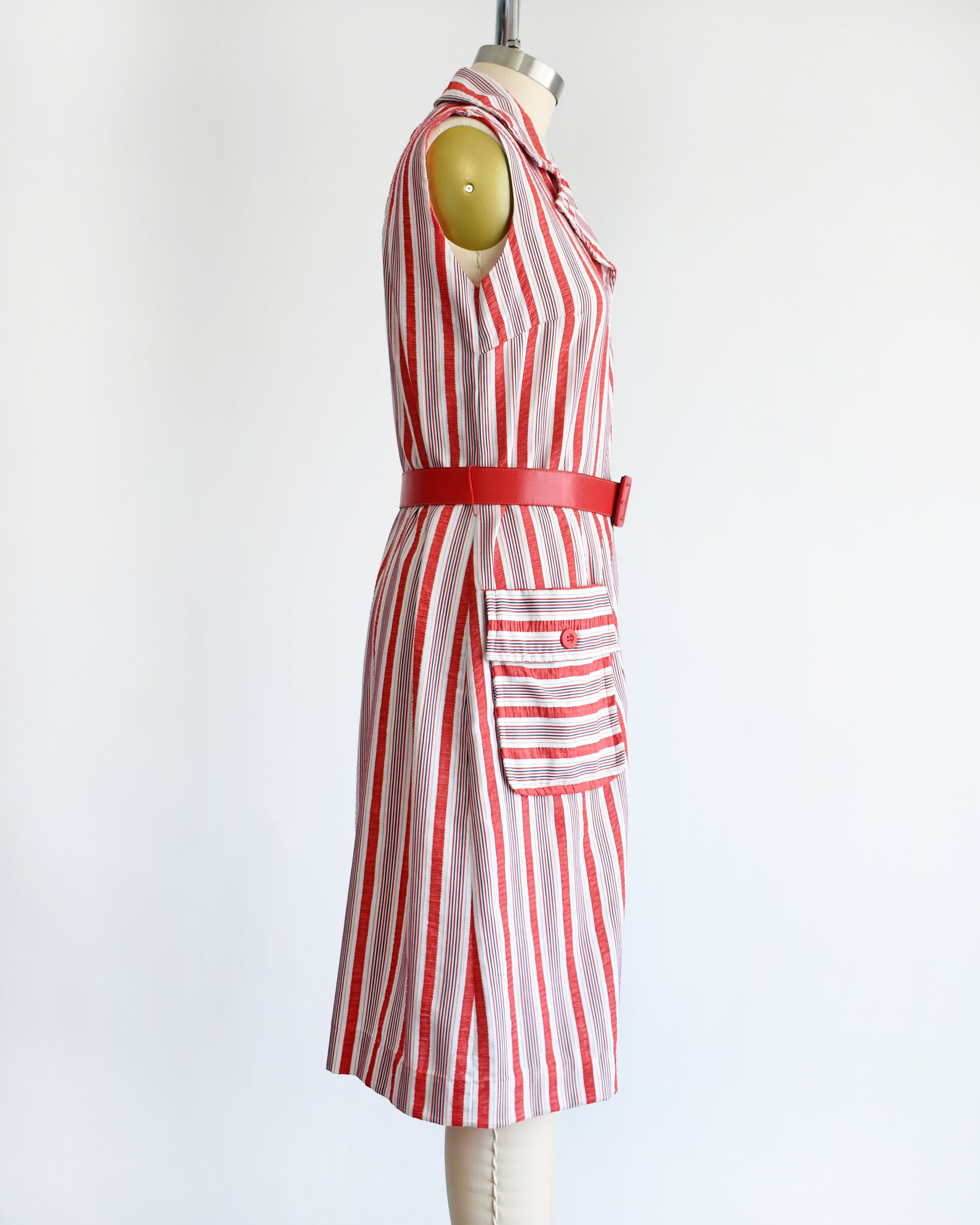 side view of a vintage 1970s red and white striped dress on a mannequin against a white background
