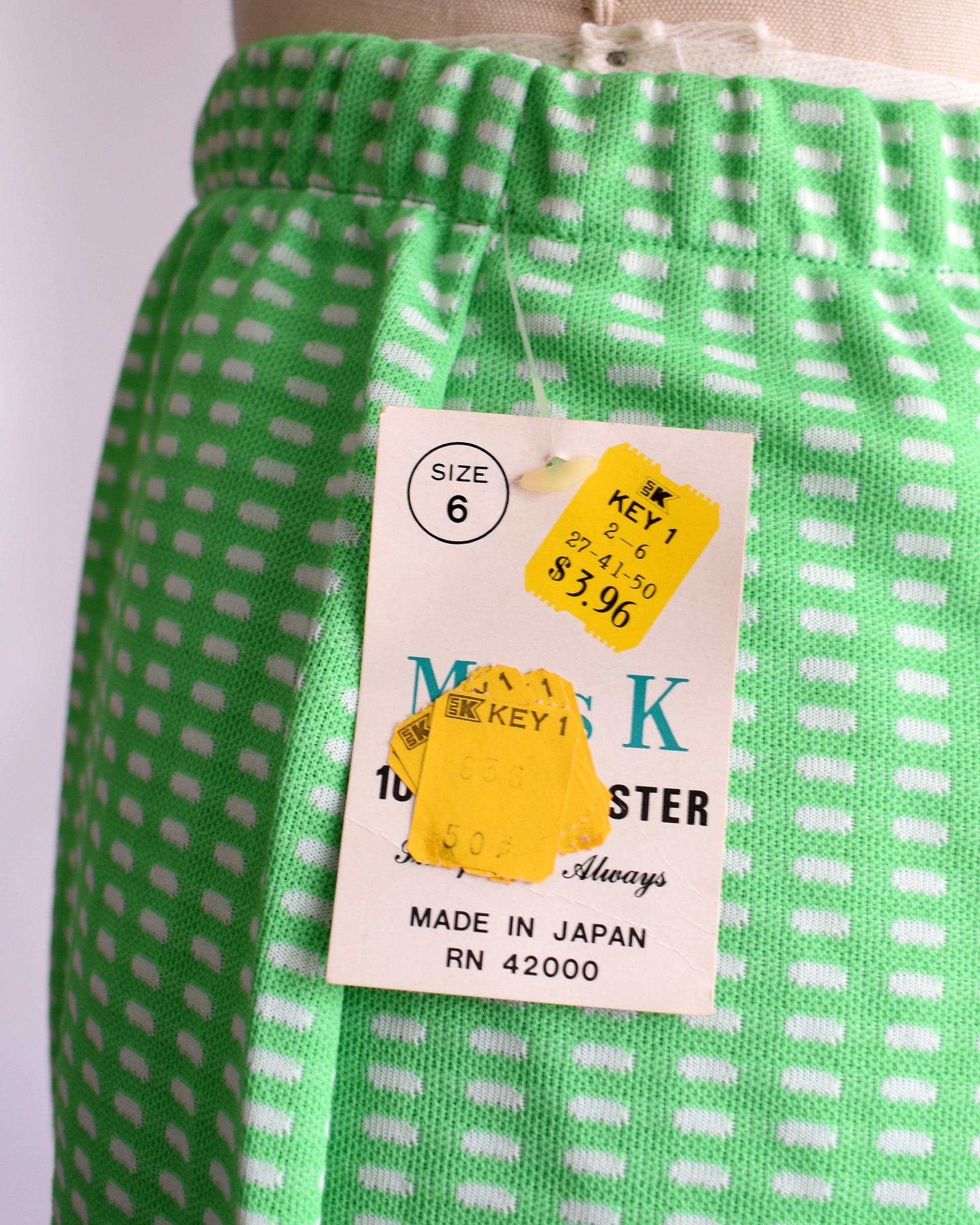 a close up of the original shop tag that is attached to the shorts