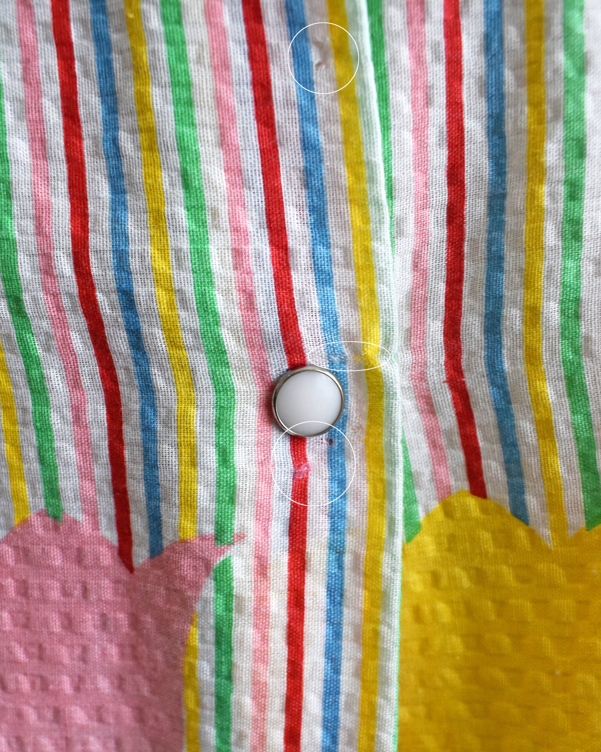 close up of small holes near the last button