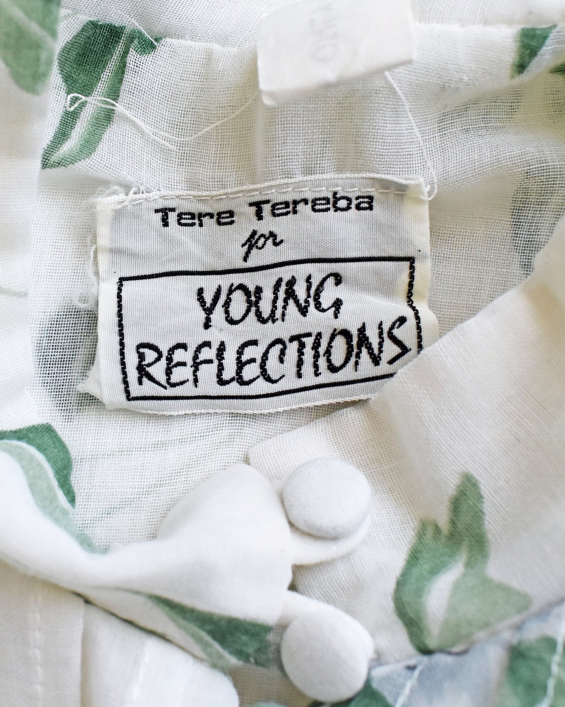 Close-up of a label on a garment with 'Tere Tereba for Young Reflections' text.