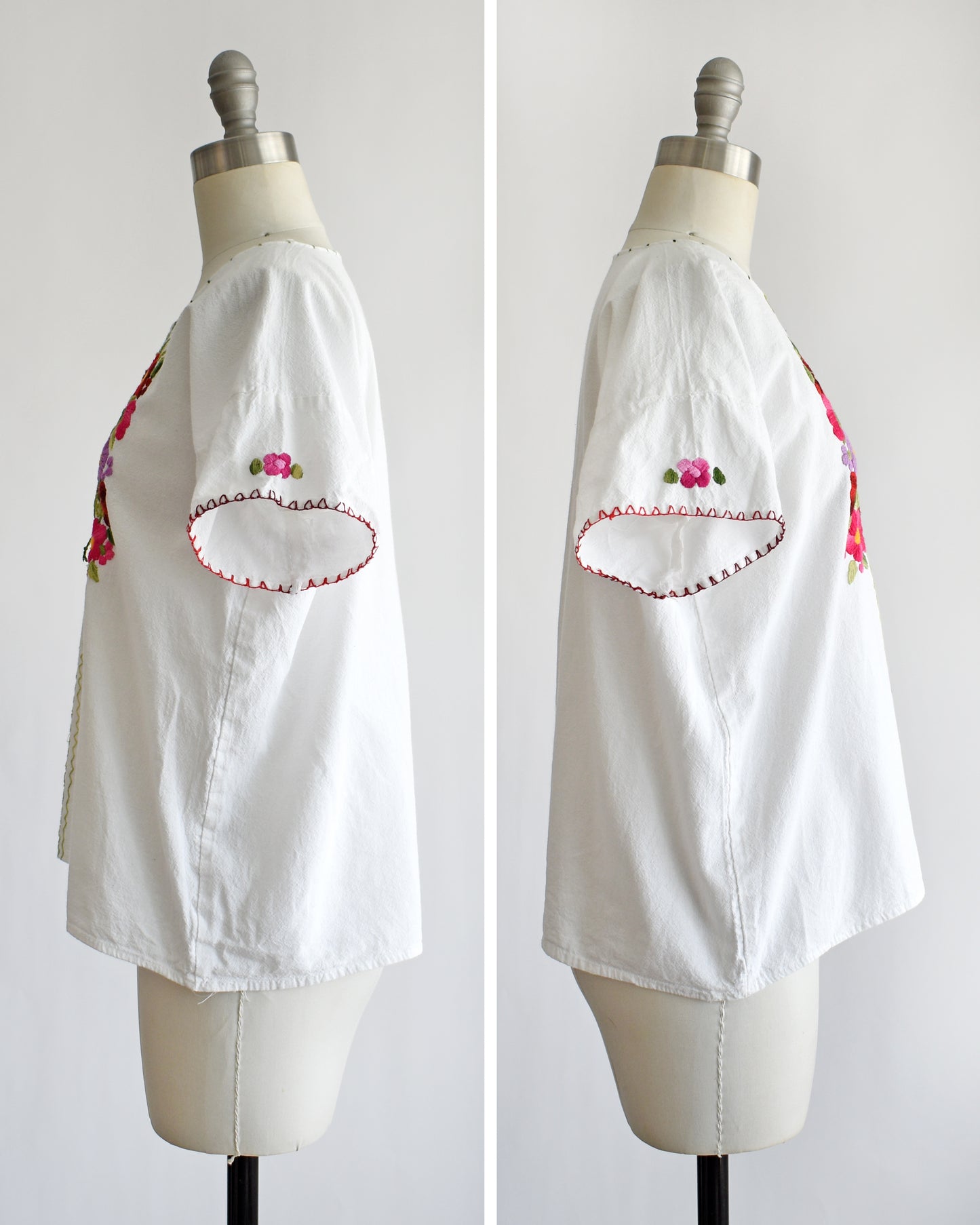 side by side view of the sides of a vintage 1970s white blouse with colorful floral embroidery on a mannequin against a white background
