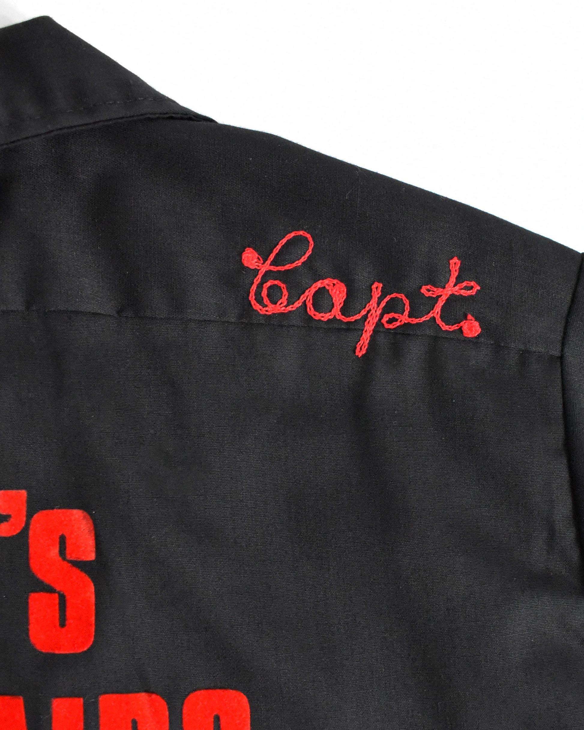 close up of the embroidered 'Capt.' on the shoulder