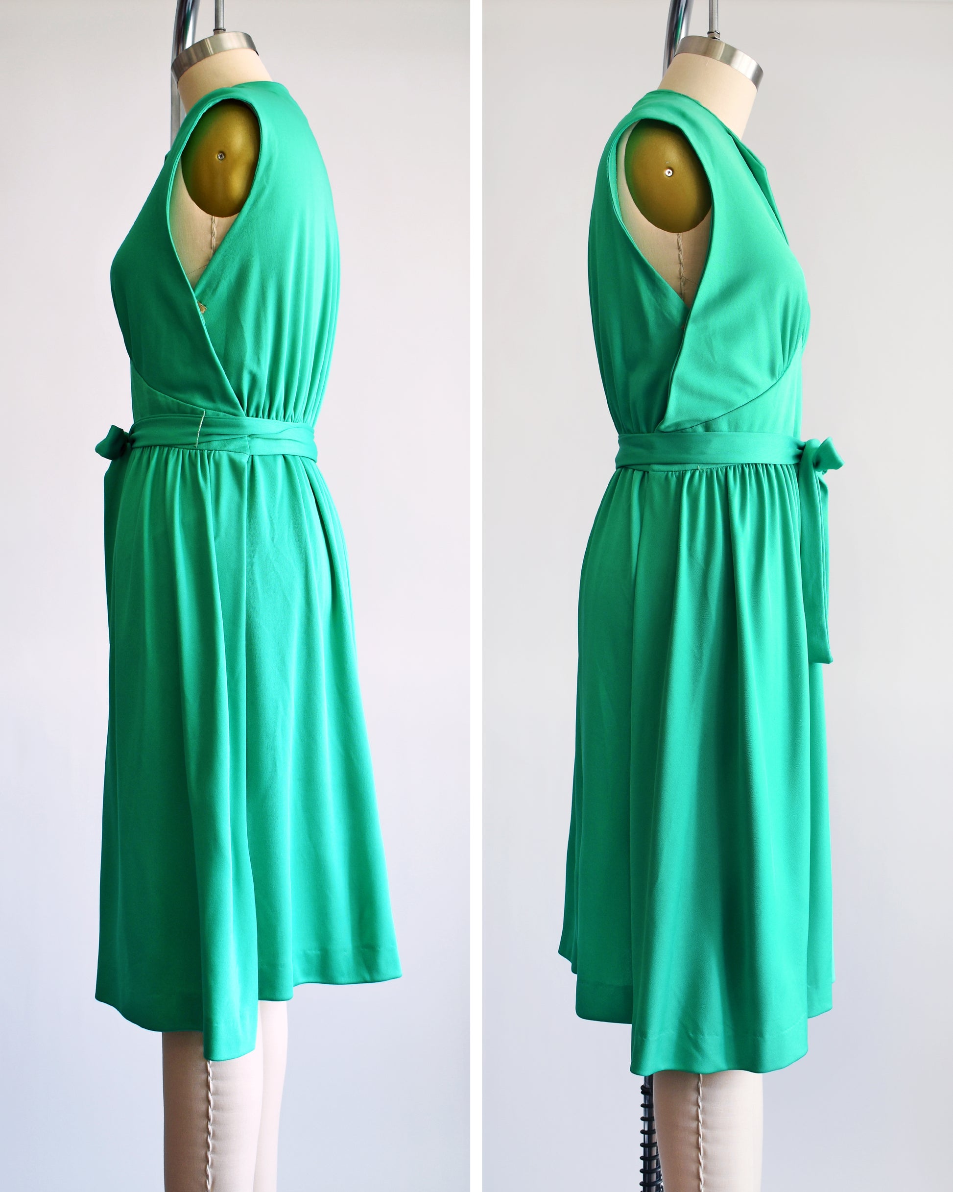 side by side view of a vintage emerald green dress that has tie wrap around the waist. the dress is on a dress form