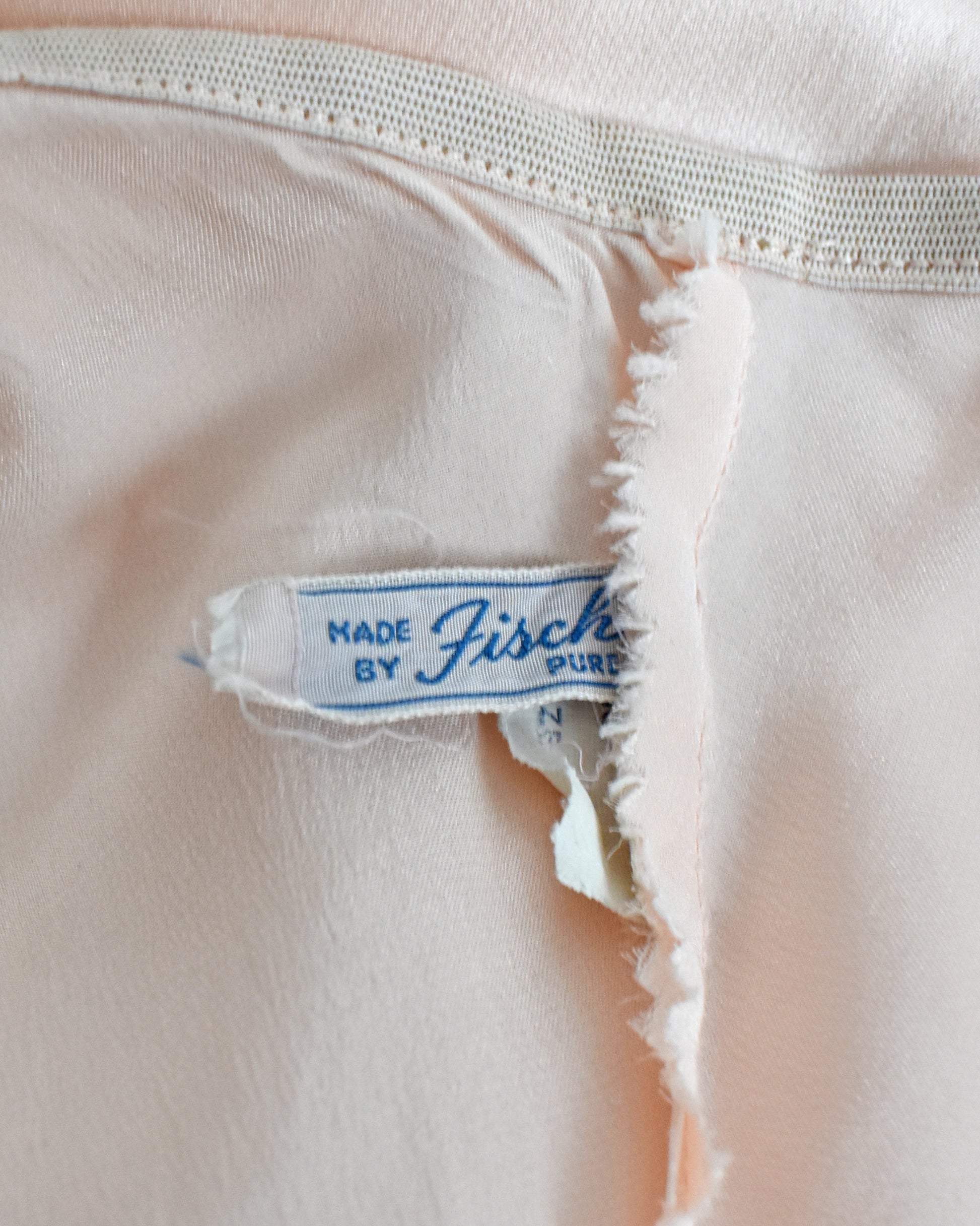 Close-up of the label which says "Made by Fischer pure silk"