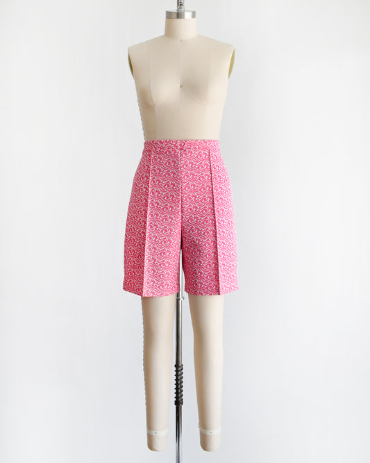 vintage 70s pink and white shorts on a mannequin against a white background