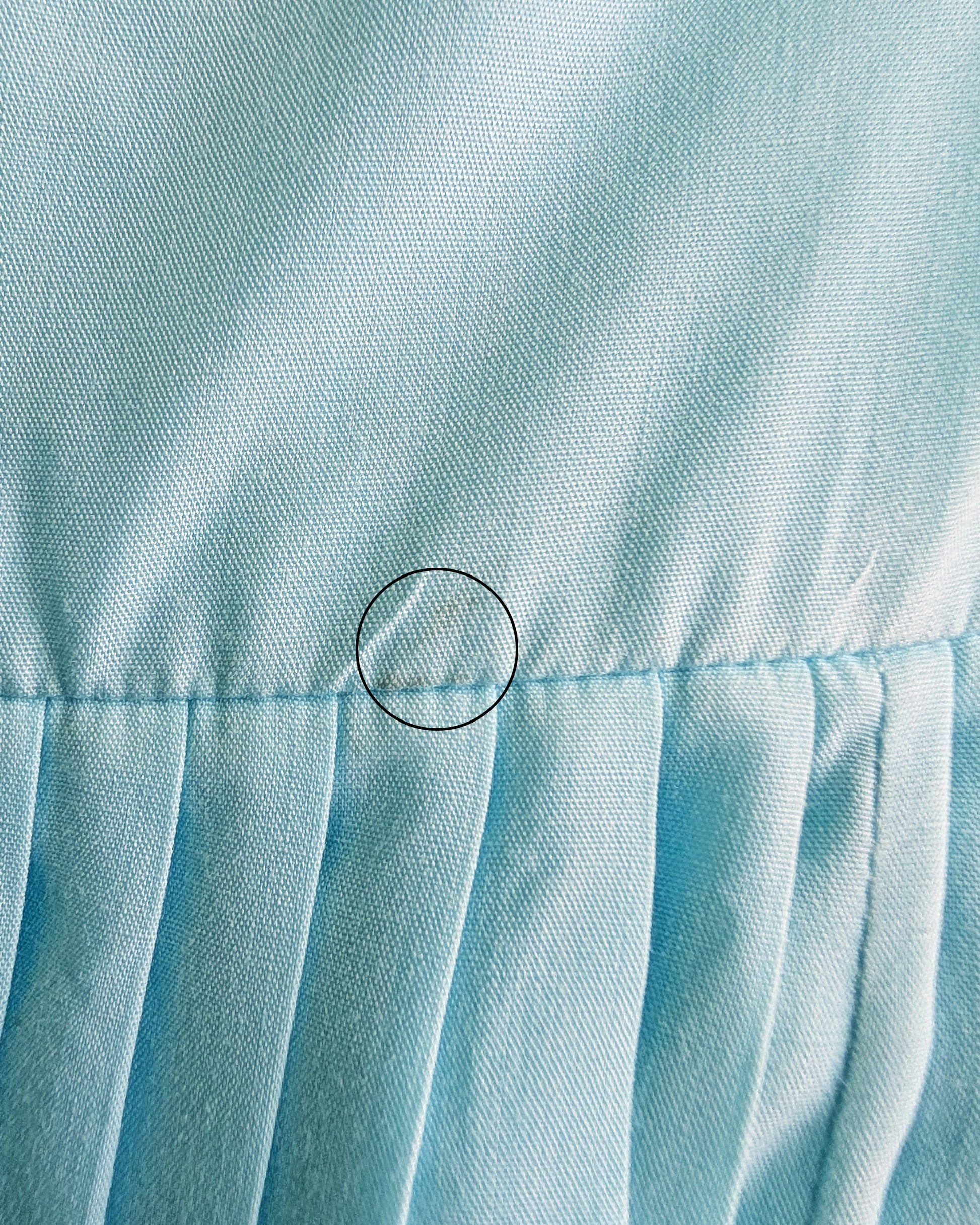 close up of a small spot on the waist that didn't come out during cleaning