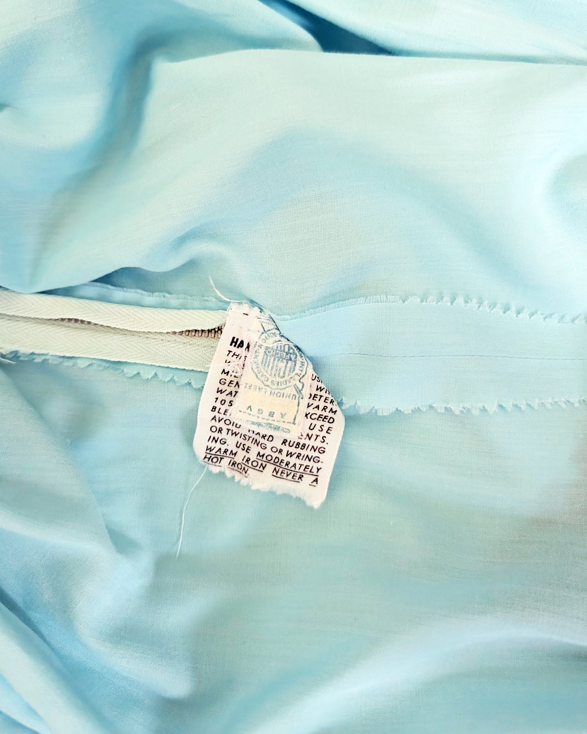 close up of the vintage ILGWU tag and care tag