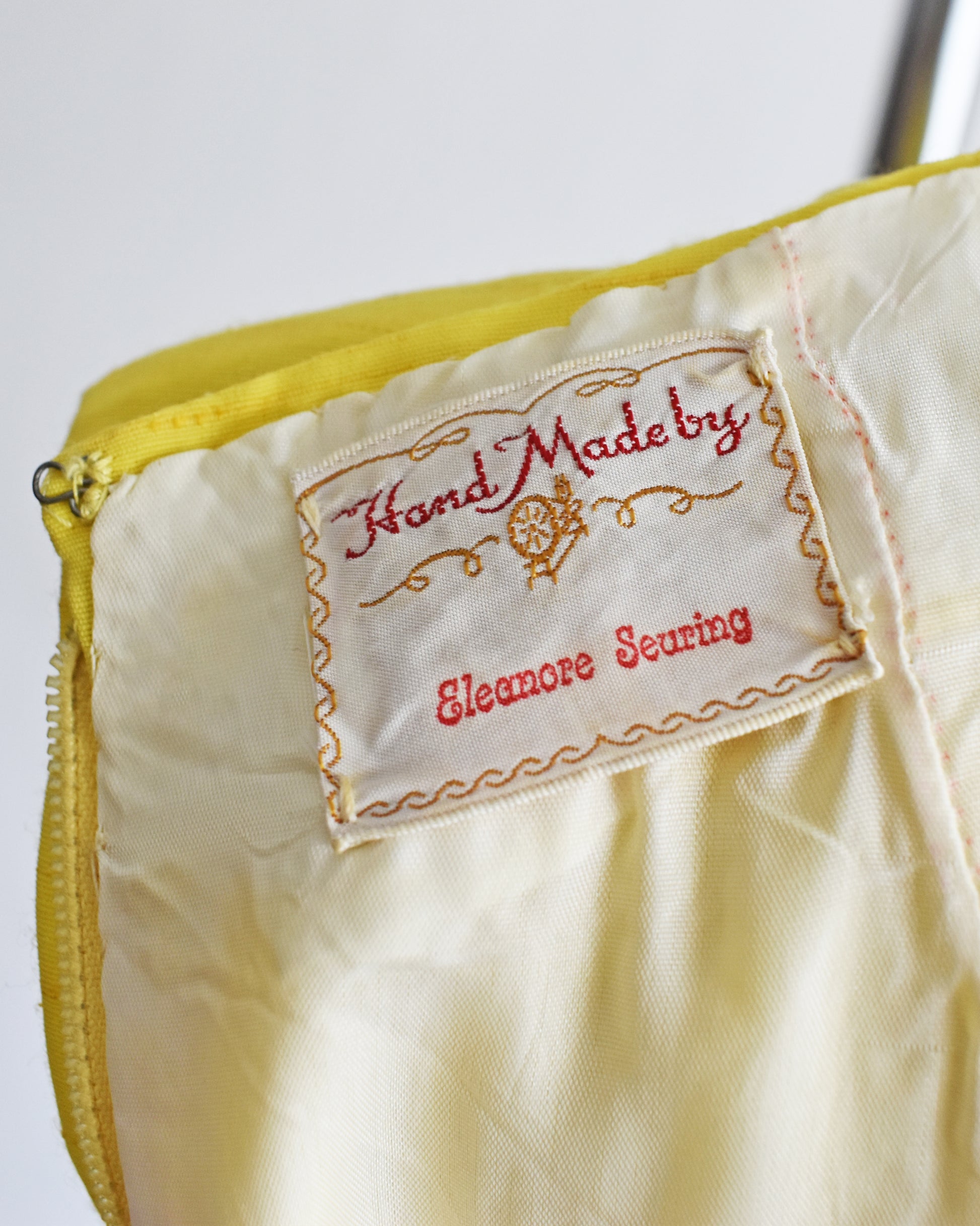 close up of the label that says "Hand Made by Eleanore Seuring"