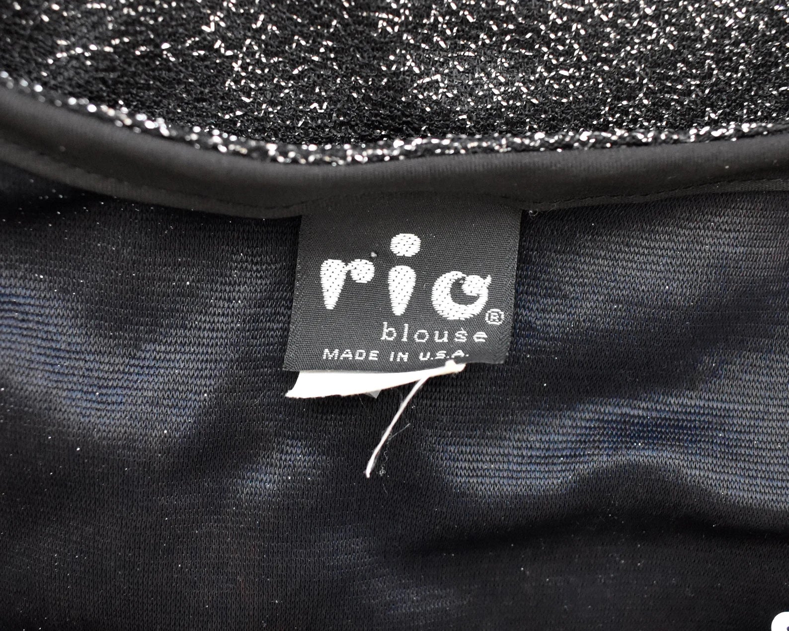 Close up of the tag that says rio blouse made in usa