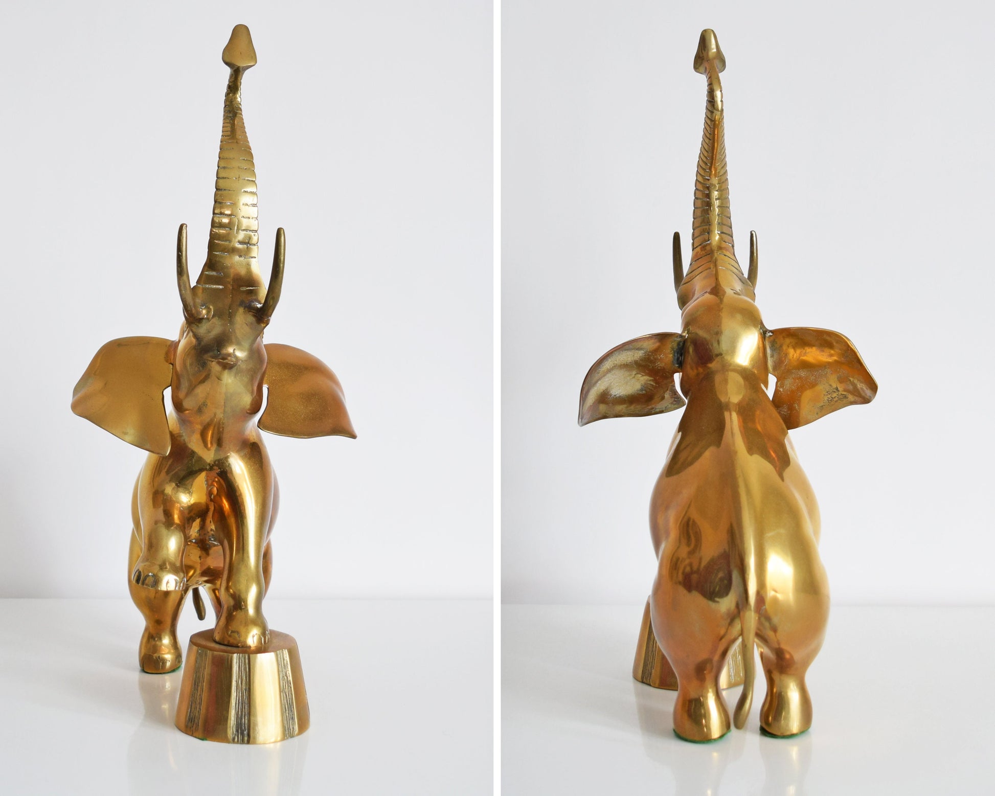 Side by side front and back view of a large brass elephant that is balancing one of its front legs on a a platform and proudly displaying its trunk up for good luck.