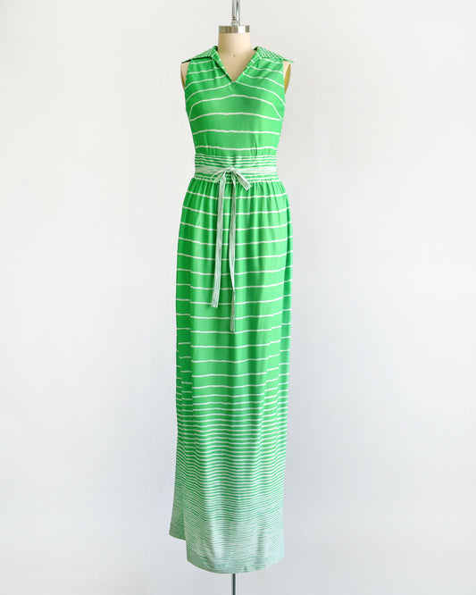 front view of a vintage green and white striped maxi dress on a dress form