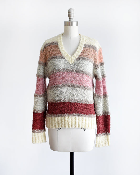 A vintage 80s v-neck horizontal striped sweater on a dress from.